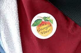 Georgia smashes records on first day of early voting as GOP hand-counting rule blocked by judge